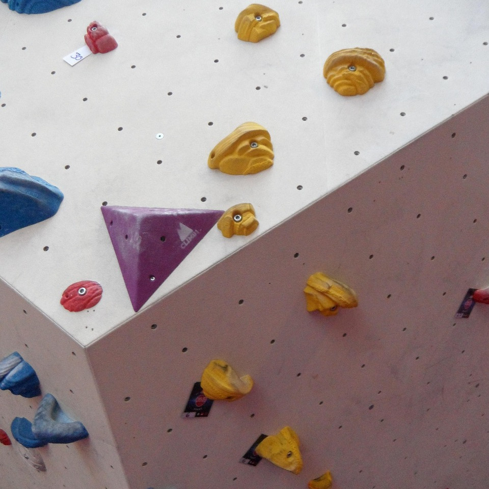 A person on a bouldering wall